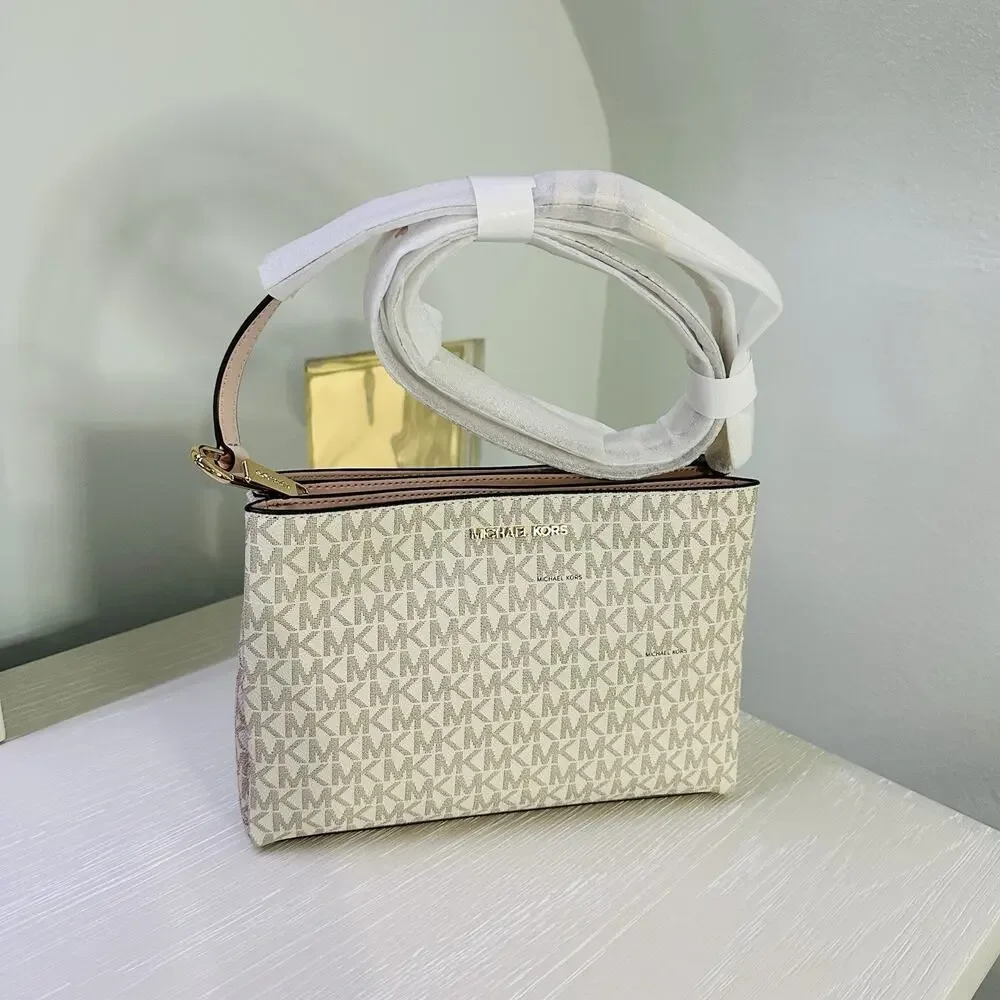 Michael Kors Trisha Medium Logo Crossbody Bag in a vanilla/light cream and pink